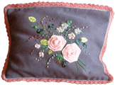 Cushion cover with flowers, ribbons